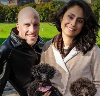 Celine Gounder with her late husband Grant Wahl and dogs